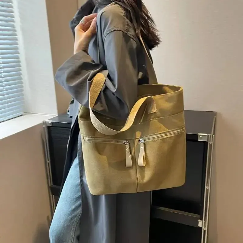 UAKISS  -  2024 New Korean Canvas Bag Women's Solid Color Versatile Large Capacity One Shoulder Handbag Personalized Commuter Tote Bag